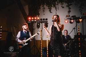 Photo of Electric Outfit Band playing at wedding at Winters Barns by wedding photographer, Parkershots